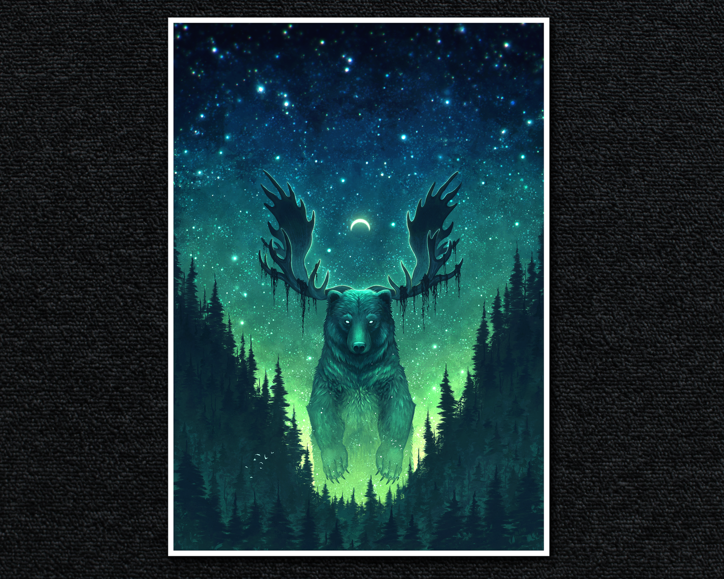 A4 Print of a giant fantasy bear with antlers. They are surrounded by a dense forest and have a dark green to blue starry sky background.